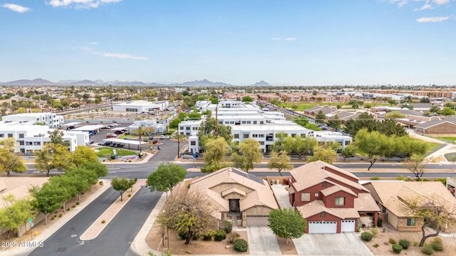 birds eye view of property featuring a mountain view and a residential view