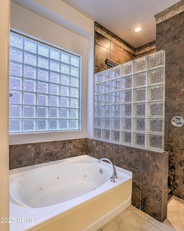 full bathroom featuring tile patterned flooring, a walk in shower, and a whirlpool tub