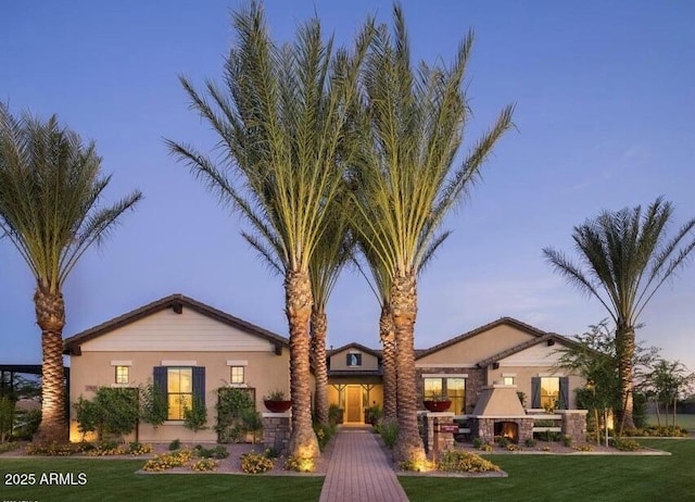 17673 E Bronco Dr, Queen Creek, AZ 85142 - view of front facade with a front yard and stucco siding