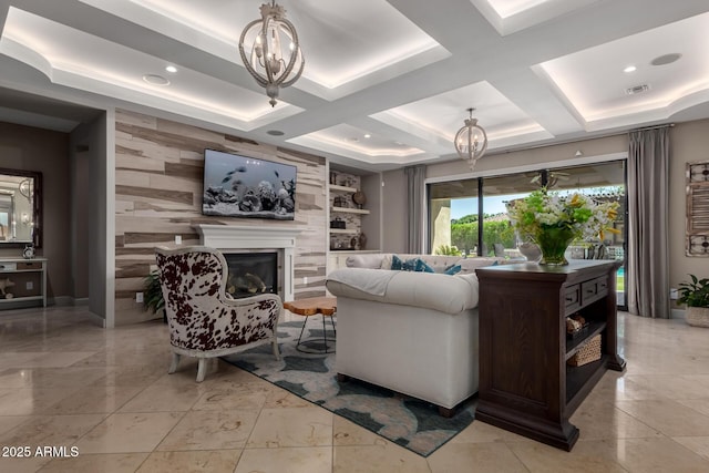 17673 E Bronco Dr, Queen Creek, AZ 85142 - living area featuring a glass covered fireplace, visible vents, a notable chandelier, and coffered ceiling