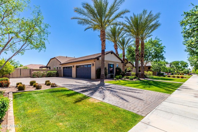 17673 E Bronco Dr, Queen Creek, AZ 85142 - ranch-style home with fence, a front lawn, stucco siding, decorative driveway, and a garage