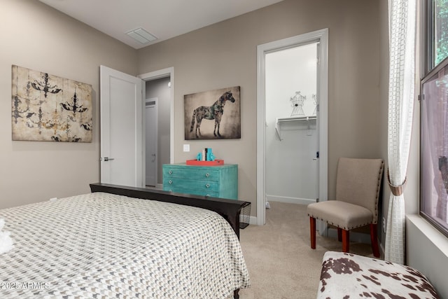 17673 E Bronco Dr, Queen Creek, AZ 85142 - bedroom featuring a closet, a walk in closet, light carpet, baseboards, and visible vents