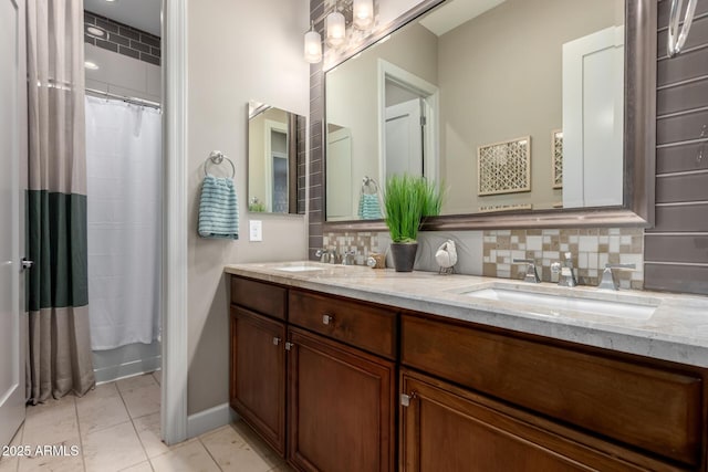 17673 E Bronco Dr, Queen Creek, AZ 85142 - full bath with baseboards, a sink, backsplash, and double vanity