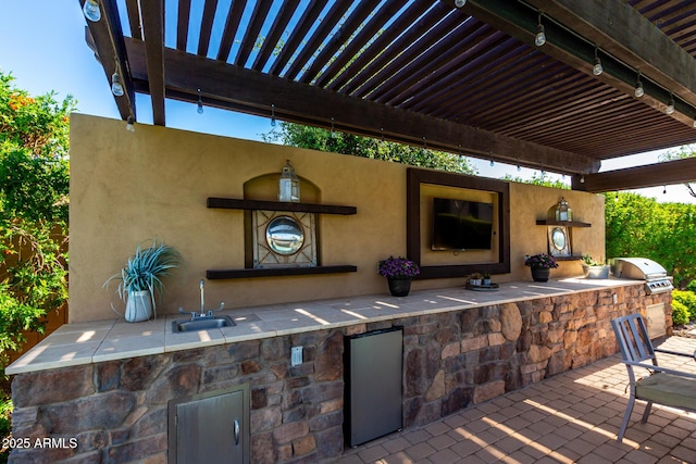 17673 E Bronco Dr, Queen Creek, AZ 85142 - view of patio featuring area for grilling, a pergola, a sink, and exterior kitchen