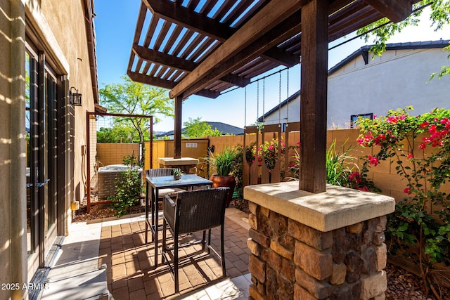 17673 E Bronco Dr, Queen Creek, AZ 85142 - view of patio with a pergola, a fenced backyard, outdoor dining space, and central AC unit