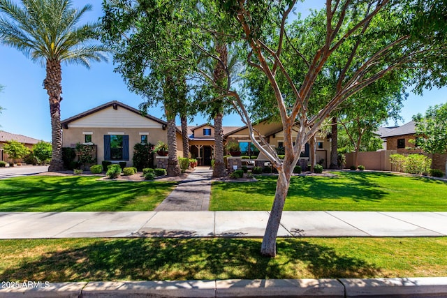 17673 E Bronco Dr, Queen Creek, AZ 85142 - view of front of property with stucco siding, a front lawn, and fence