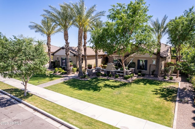 17673 E Bronco Dr, Queen Creek, AZ 85142 - view of front of house with stucco siding, a front lawn, and a tiled roof