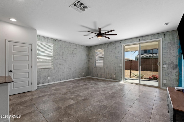 5429 W Chuck Box Rd, Laveen, AZ 85339 - spare room with ceiling fan and baseboards