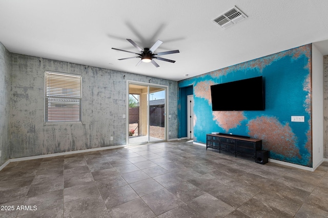 5429 W Chuck Box Rd, Laveen, AZ 85339 - unfurnished living room featuring a ceiling fan, baseboards, wallpapered walls, and an accent wall