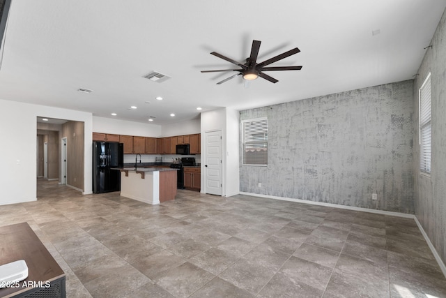5429 W Chuck Box Rd, Laveen, AZ 85339 - unfurnished living room featuring a ceiling fan, baseboards, recessed lighting, and a sink