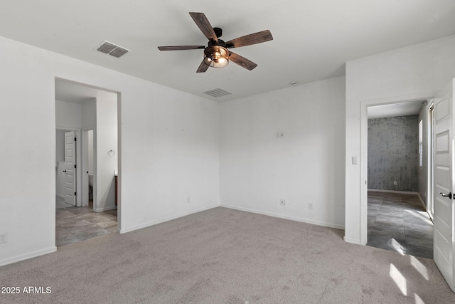 5429 W Chuck Box Rd, Laveen, AZ 85339 - unfurnished bedroom featuring carpet, baseboards, and a ceiling fan