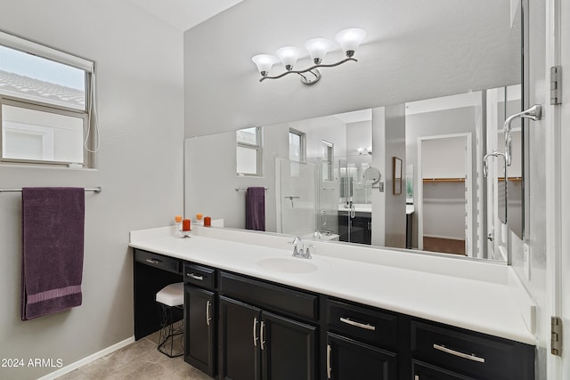 bathroom with vanity, tile patterned floors, and an enclosed shower