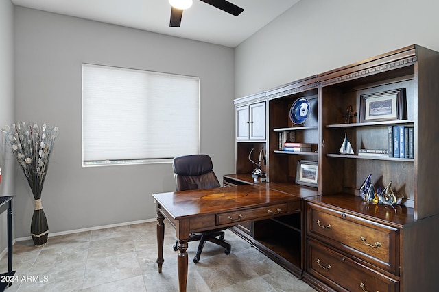 tiled office space with ceiling fan