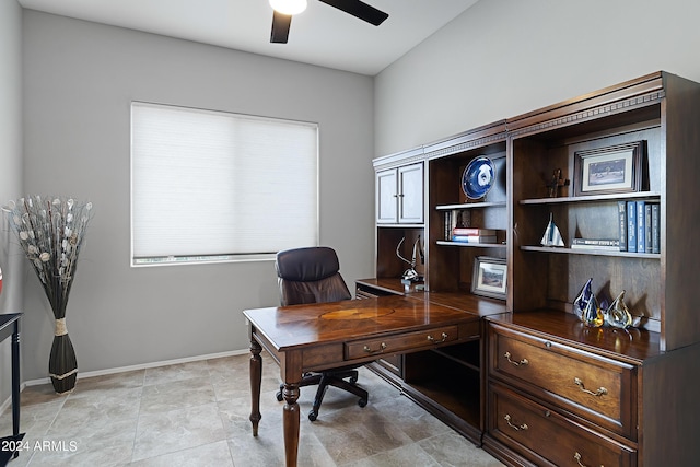 office featuring baseboards and a ceiling fan