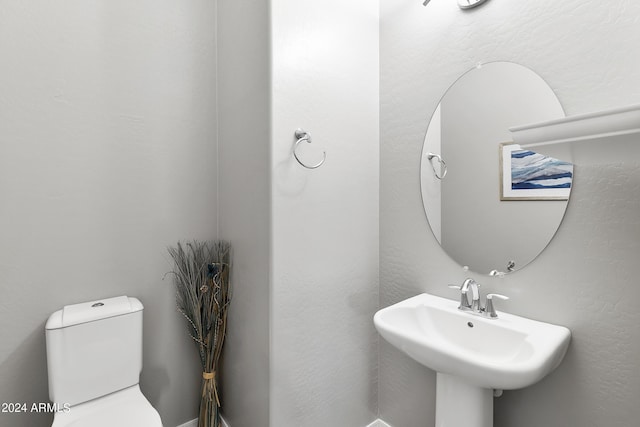 bathroom featuring a sink and toilet