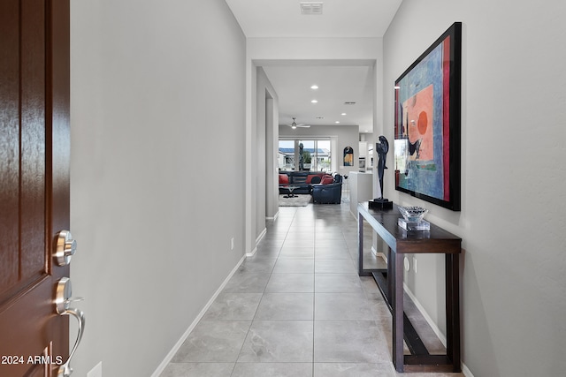 corridor with light tile patterned floors