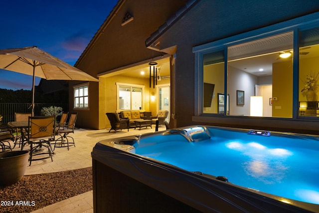 view of swimming pool with fence, outdoor dining space, a hot tub, an outdoor hangout area, and a patio area