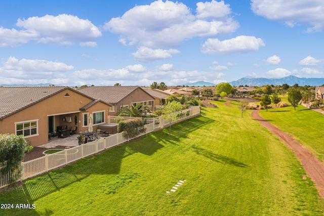 birds eye view of property with a mountain view