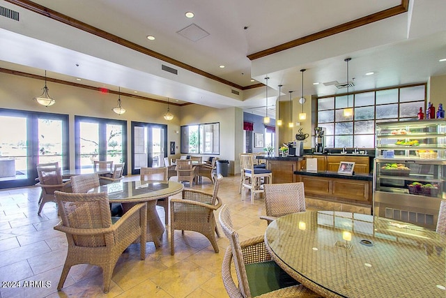 dining space with crown molding, recessed lighting, and visible vents