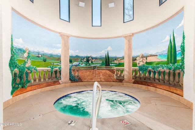 view of swimming pool featuring an indoor hot tub and a patio area