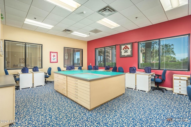 miscellaneous room with carpet floors, a paneled ceiling, and visible vents