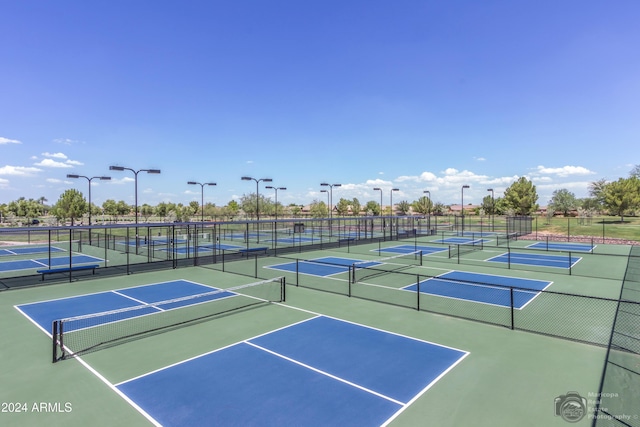 view of tennis court with fence