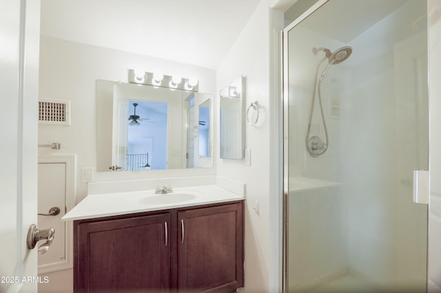 5749 S 21st Ter, Phoenix, AZ 85040 - bathroom featuring a stall shower, vanity, and ceiling fan
