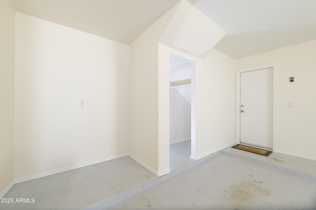 5749 S 21st Ter, Phoenix, AZ 85040 - unfurnished room with baseboards and vaulted ceiling