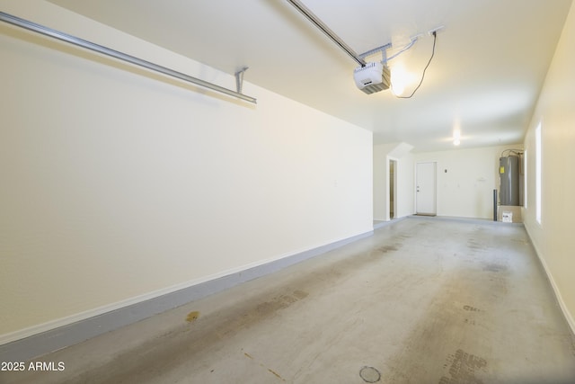5749 S 21st Ter, Phoenix, AZ 85040 - garage featuring electric water heater, a garage door opener, and baseboards