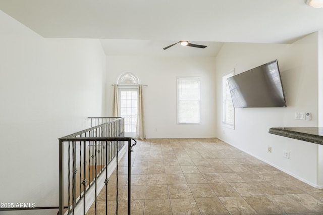 5749 S 21st Ter, Phoenix, AZ 85040 - unfurnished living room featuring a ceiling fan and baseboards