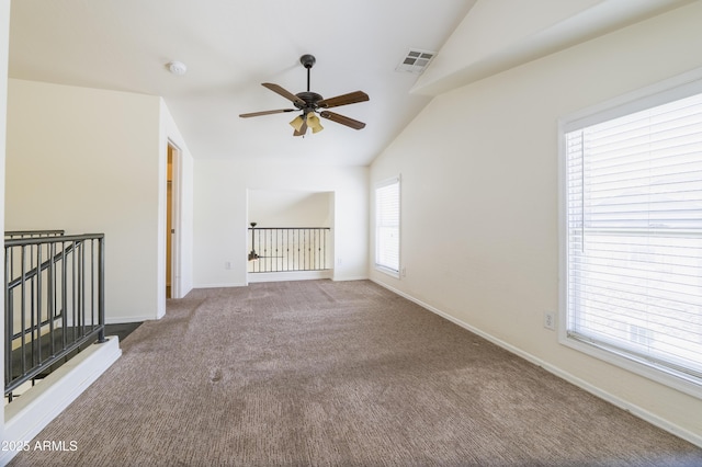 5749 S 21st Ter, Phoenix, AZ 85040 - empty room featuring vaulted ceiling, ceiling fan, carpet floors, baseboards, and a smoke detector