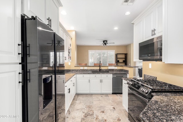 kitchen featuring visible vents, a sink, black range with gas stovetop, dishwasher, and refrigerator with ice dispenser