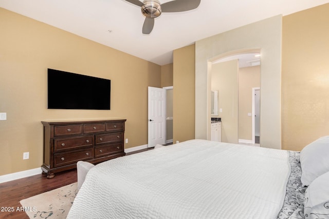 bedroom featuring baseboards, dark wood-type flooring, and ceiling fan