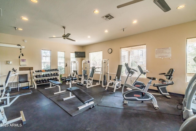 exercise room with recessed lighting, visible vents, a healthy amount of sunlight, and ceiling fan