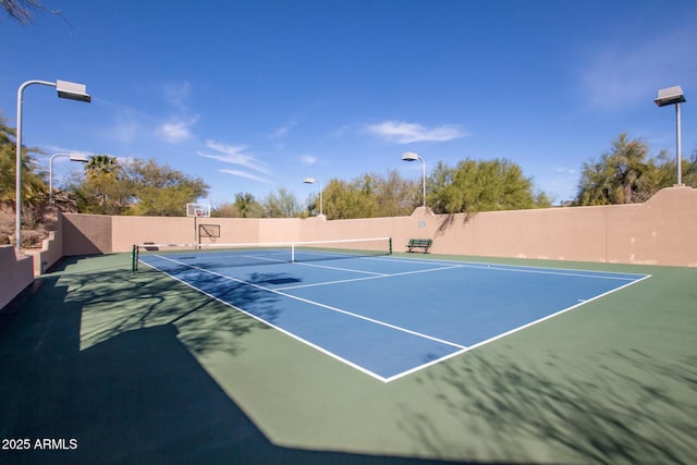 view of sport court with community basketball court and fence