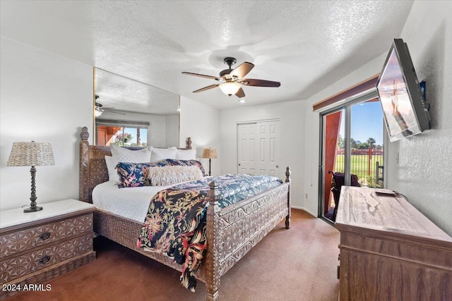 bedroom featuring ceiling fan, a textured ceiling, and multiple windows