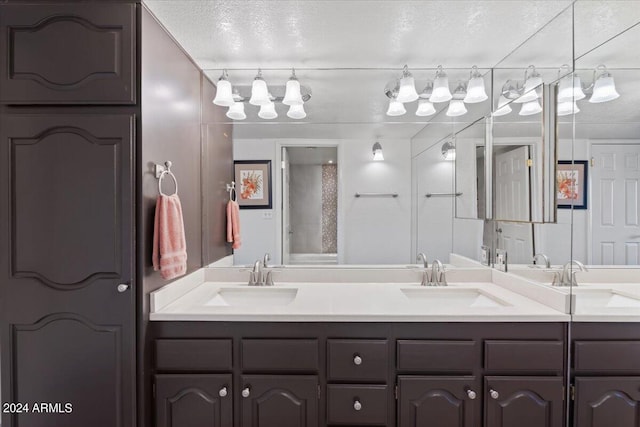 bathroom featuring vanity and a textured ceiling