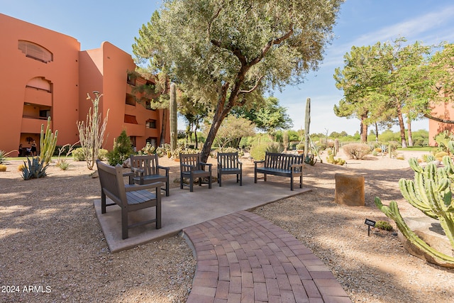 view of home's community with a patio area