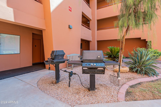 view of patio featuring a balcony