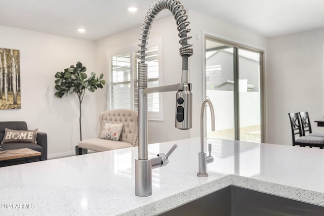 interior details featuring light stone countertops