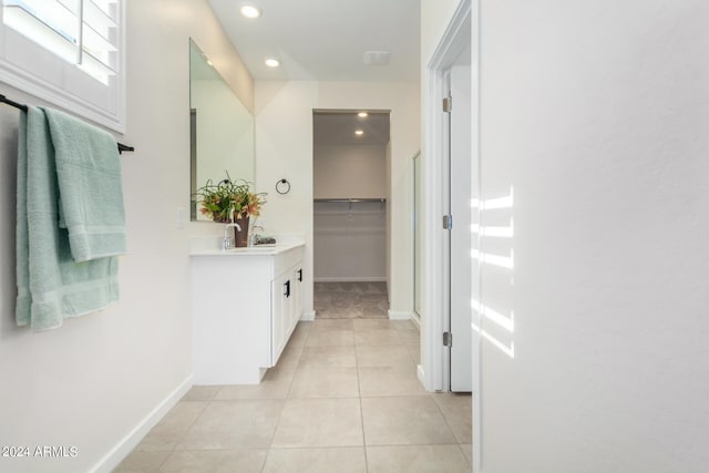 hall featuring light tile patterned flooring