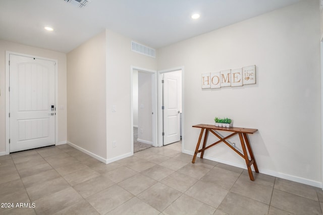 hallway with light tile patterned floors