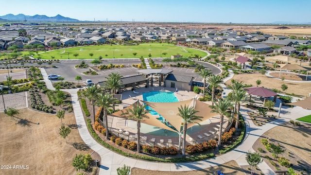 birds eye view of property with a mountain view