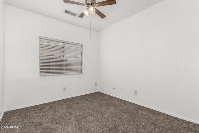 carpeted empty room featuring ceiling fan