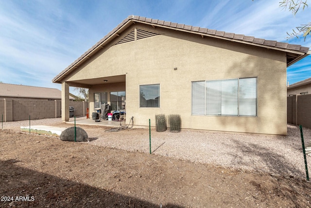 back of house featuring a patio area