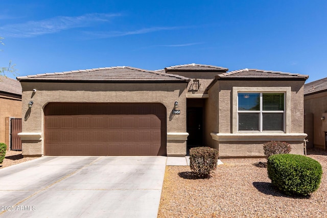 36454 W Picasso St, Maricopa, AZ 85138 - prairie-style home with an attached garage, concrete driveway, and stucco siding