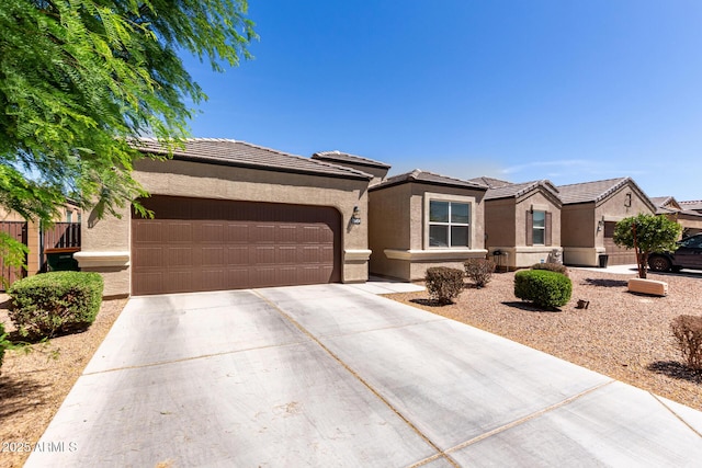 36454 W Picasso St, Maricopa, AZ 85138 - view of front of house featuring concrete driveway, an attached garage, and stucco siding