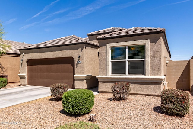 36454 W Picasso St, Maricopa, AZ 85138 - view of front facade with a garage, stucco siding, concrete driveway, and a tile roof