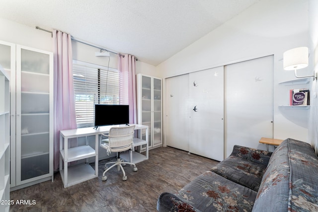 office area with a textured ceiling and lofted ceiling