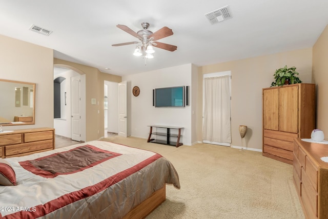 bedroom featuring light carpet and ceiling fan